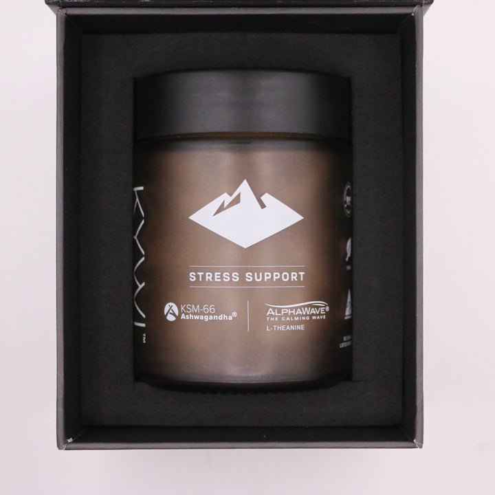 Top view of the Kywi Stress Support jar nested in its black gift box